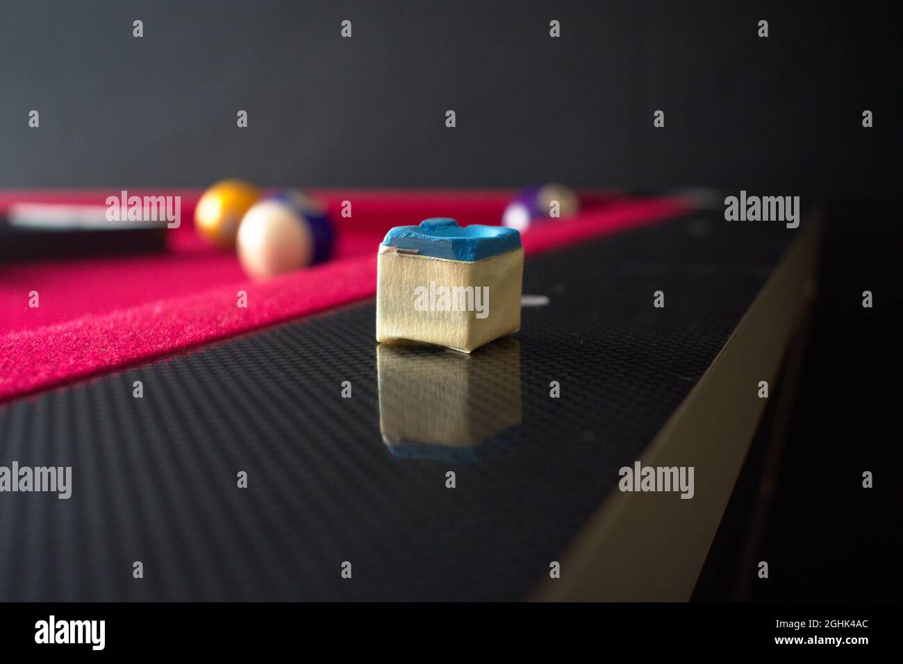 pool cue chalk on a billiards table with balls and rack Stock Photo Alamy