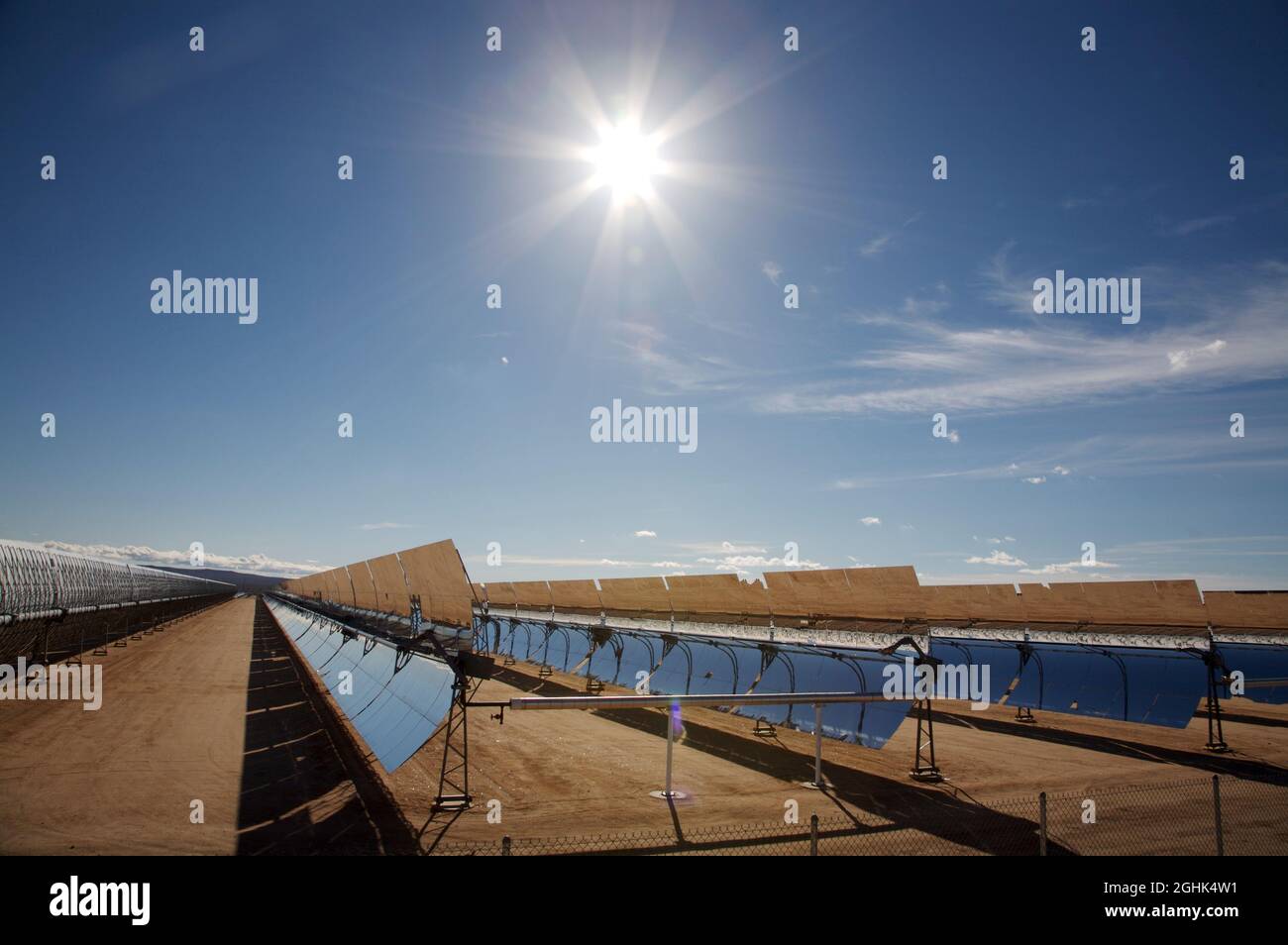Solar collector array and sun star at energy farm in the Mojave Desert, California, USA Stock Photo
