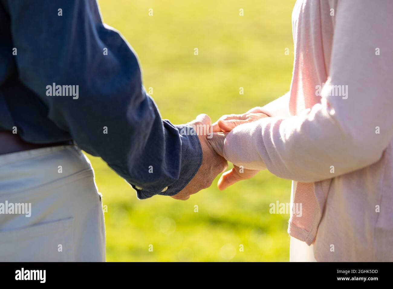 Happy senior couple holding hands Stock Photo