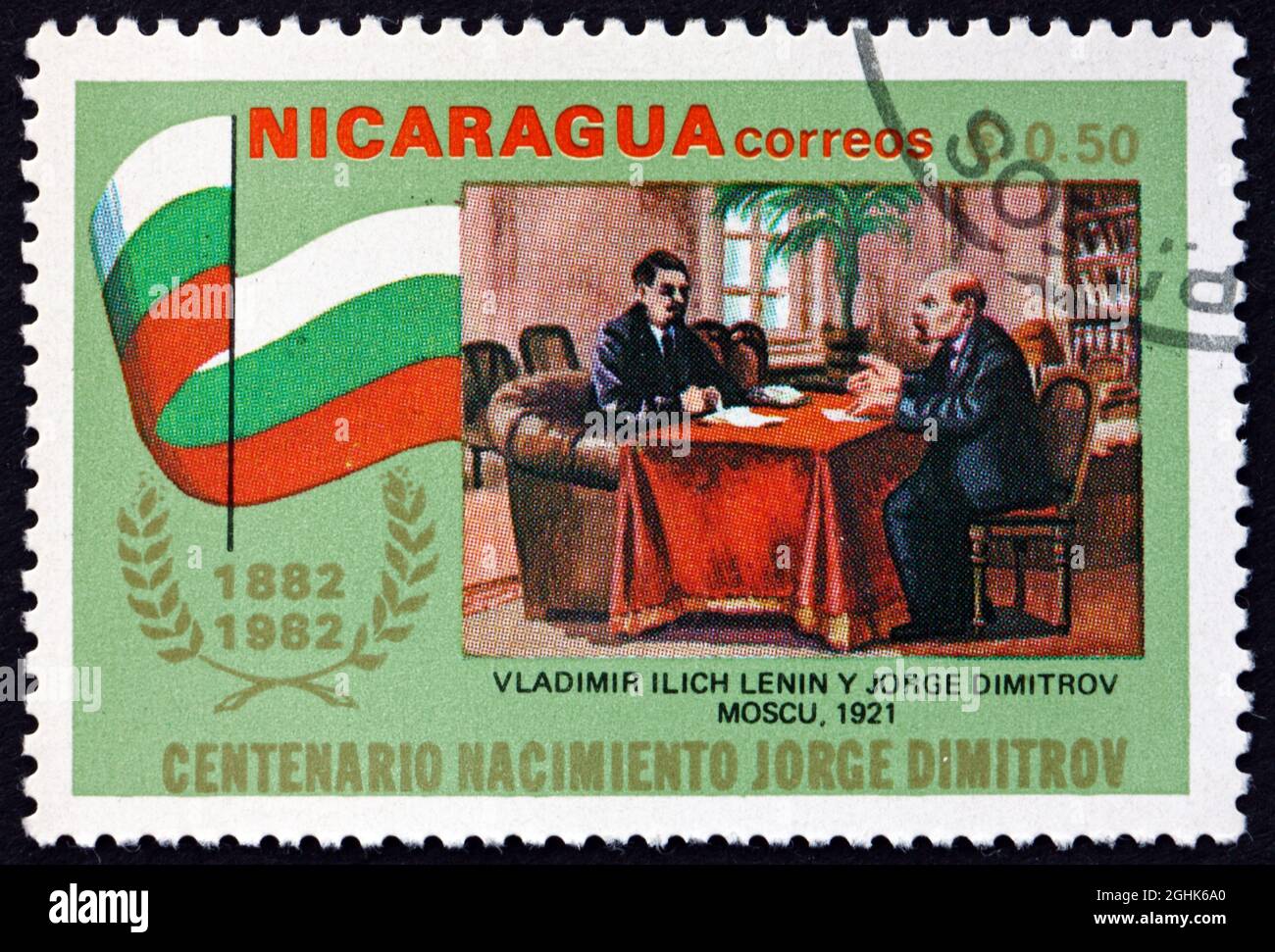 NICARAGUA - CIRCA 1982: a stamp printed in Nicaragua shows Lenin and Dimitrov, 1921, circa 1982 Stock Photo