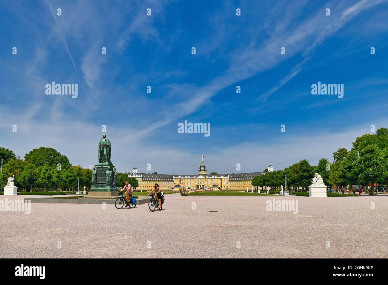 Karlsruhe, Germany - August 2021: Town square called 'Schlosplatz' in front of  baroque Karlsruhe Palace with garden Stock Photo