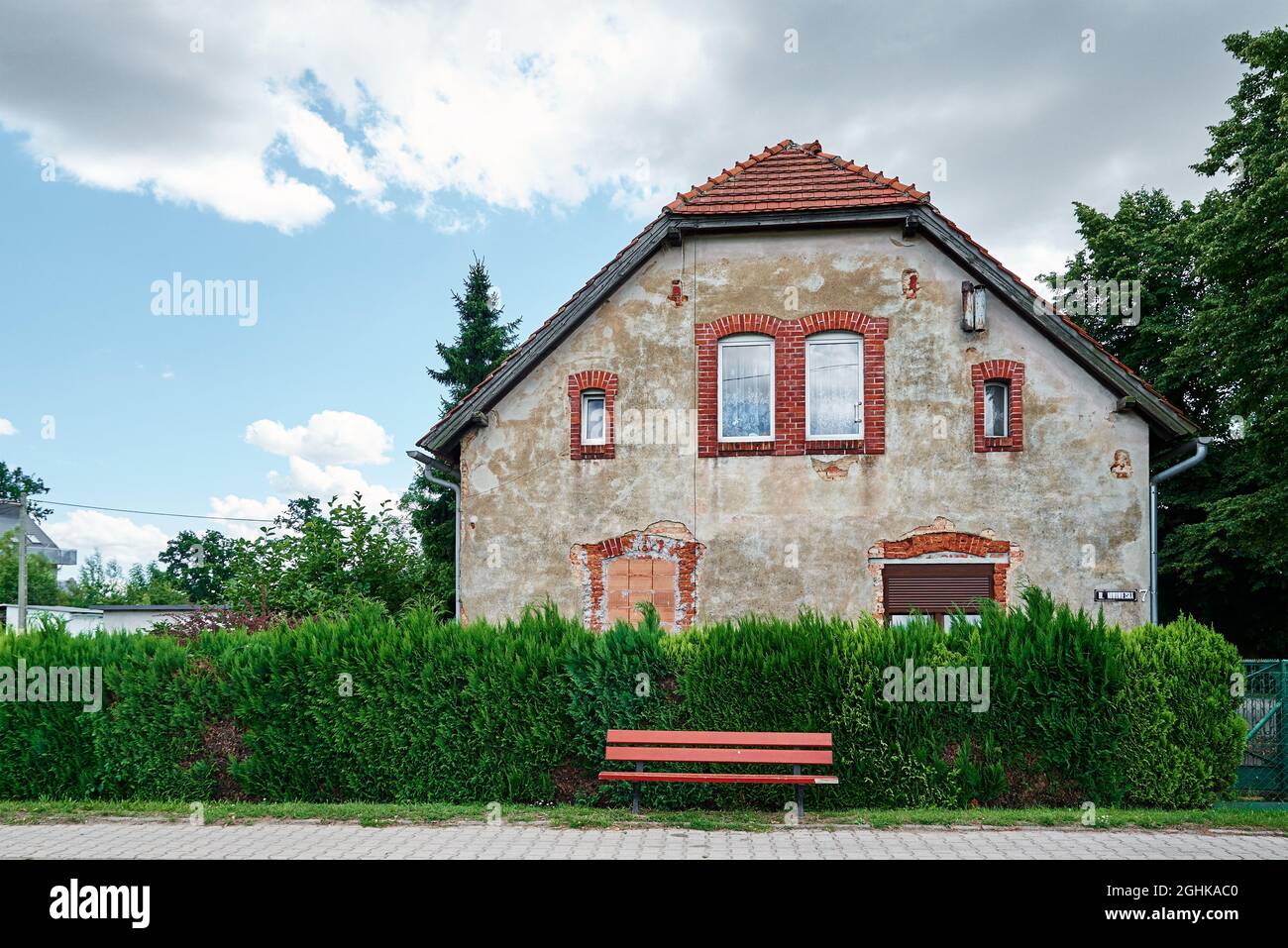 Exterior of old house with bench for relax and rest Stock Photo - Alamy