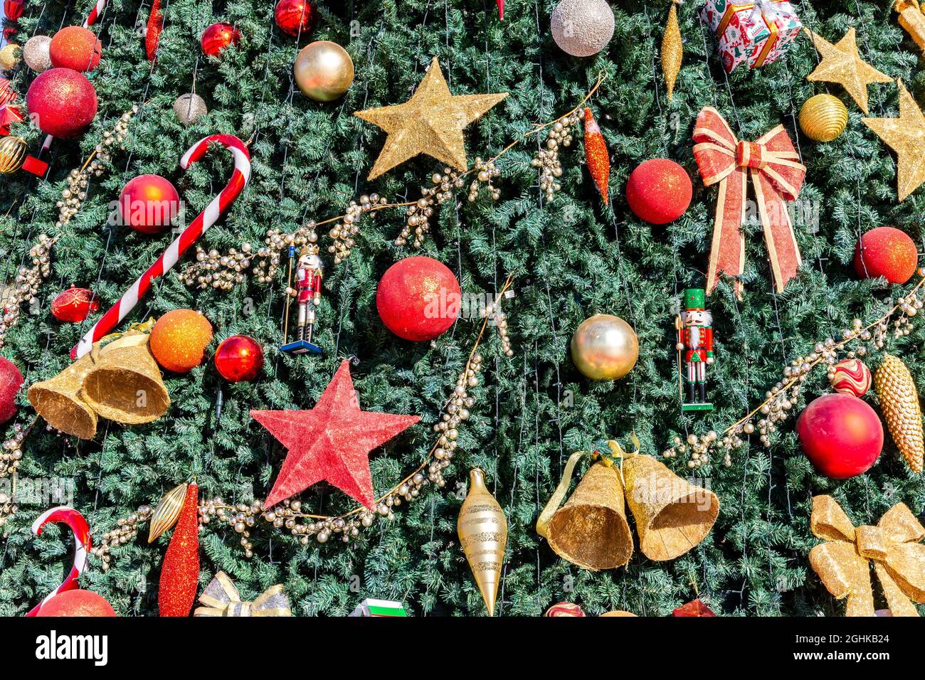 Christmas decorations on a large christmas tree, with stars, bells