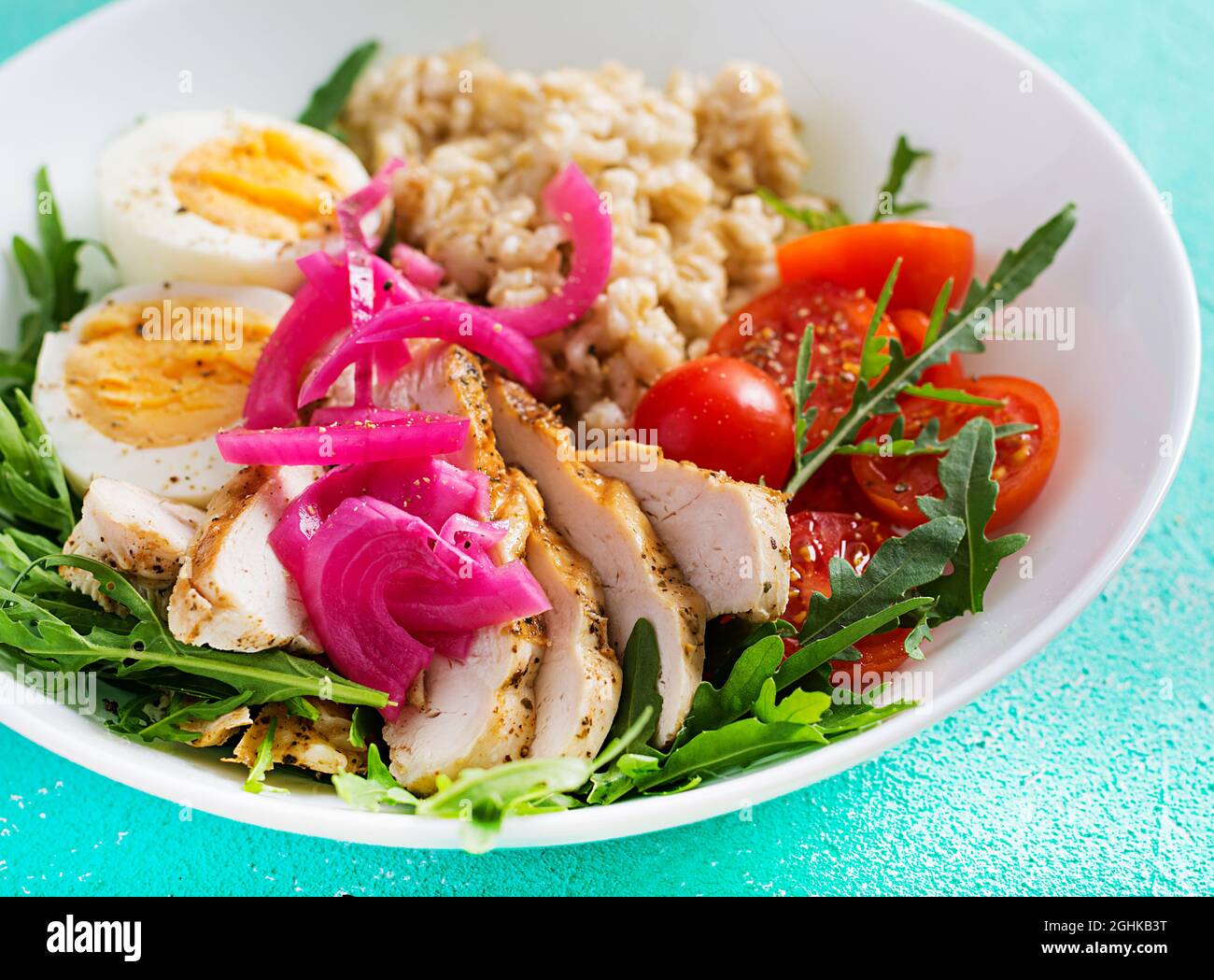 Fillet Breakfast Fresh salad. Breakfast bowl with oatmeal, chicken fillet, tomato, red ...