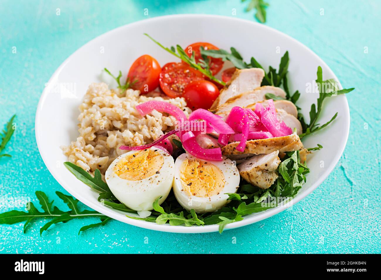 Fillet Breakfast Fresh salad. Breakfast bowl with oatmeal, chicken fillet, tomato, red ...