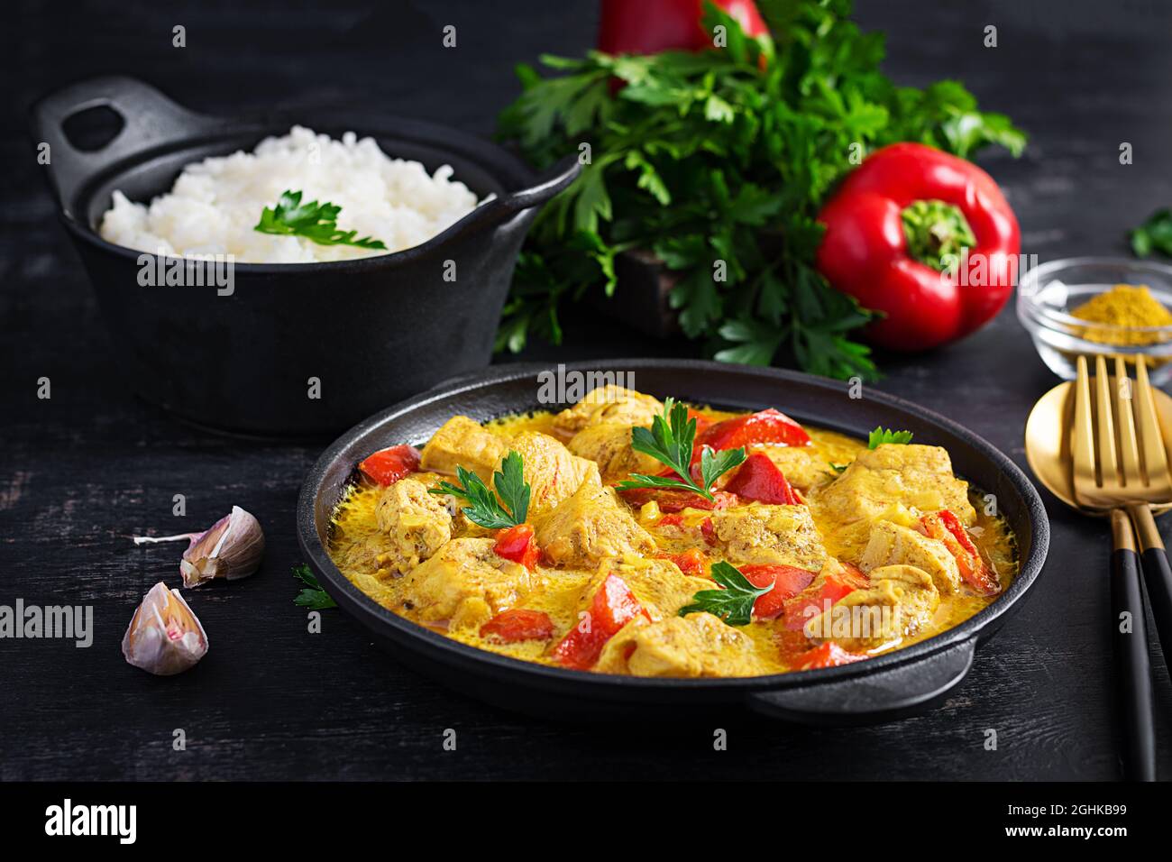 Traditional Indian curry chicken masala. Indian chicken curry with sweet peppers and rice in
