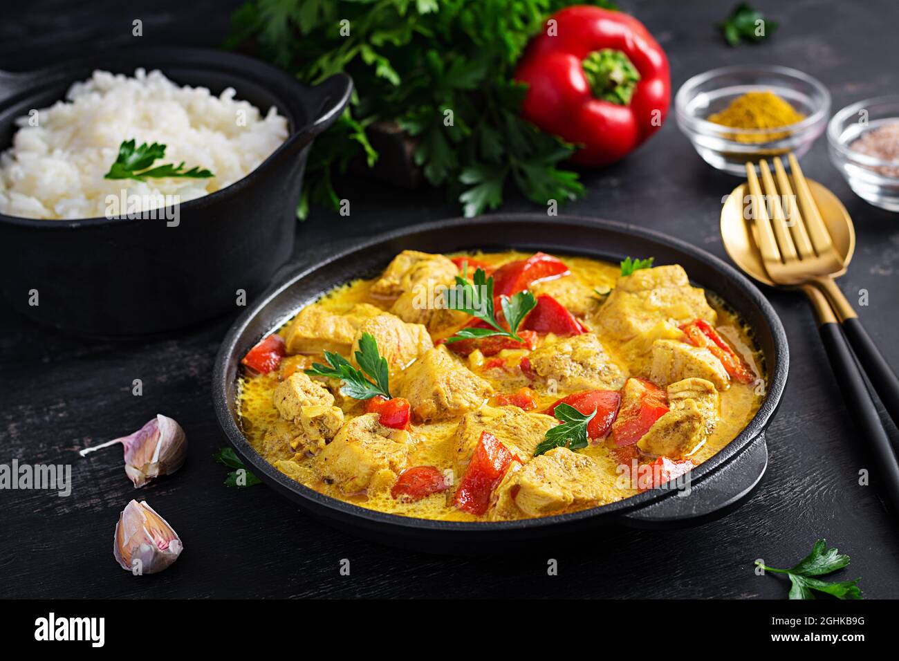 Traditional Indian curry chicken masala. Indian chicken curry with sweet peppers and rice in