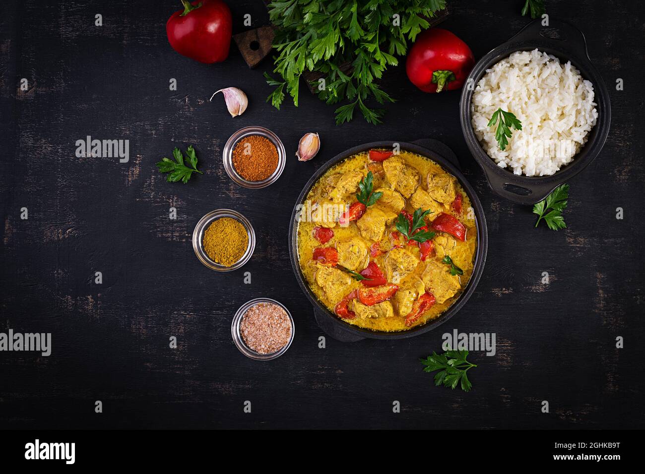 Traditional Indian curry chicken masala. Indian chicken curry with sweet peppers and rice in