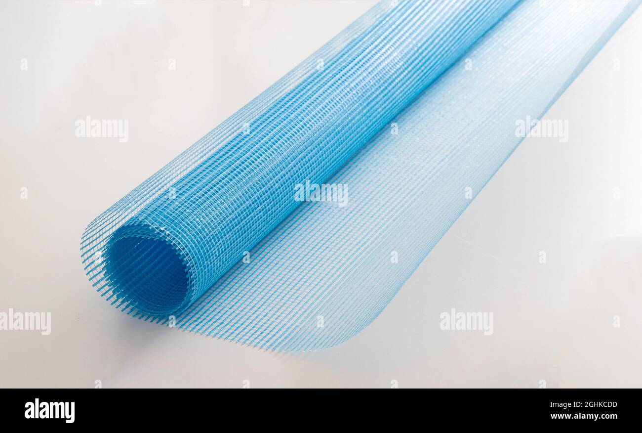 Blue reinforcing construction mesh for wall strengthening on white background, isolate. Stock Photo