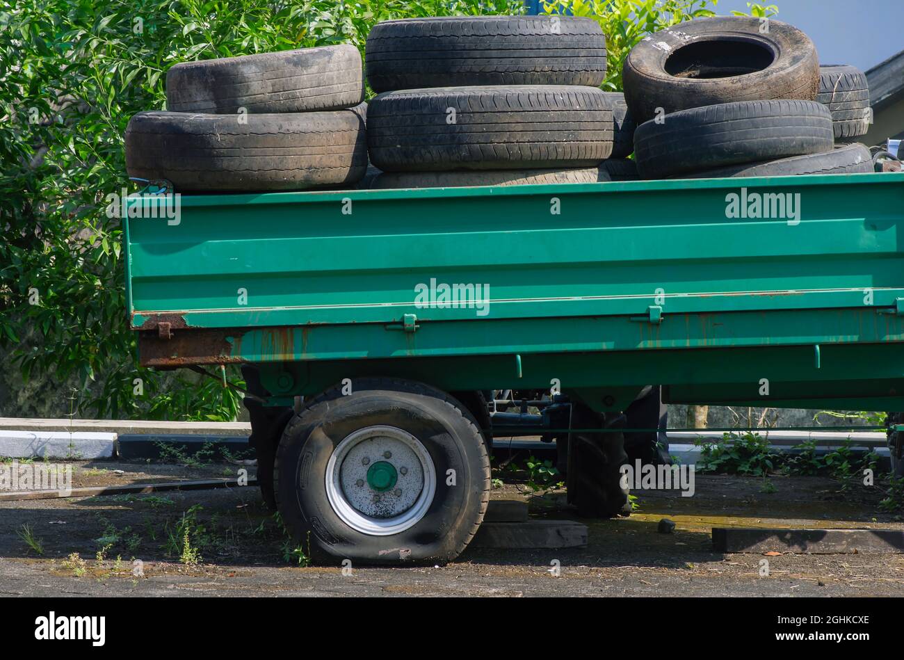Pile of used tires in a pickup truck with a flat tire Stock Photo Alamy