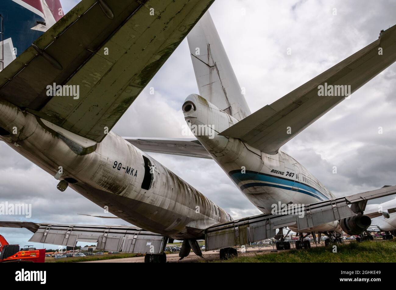 Retired Boeing 747 and DC-8 airliner planes stored pending scrapping at Manston Airport boneyard. 9G-MKA formerly MK Air Cargo Douglas DC-8 freighter Stock Photo