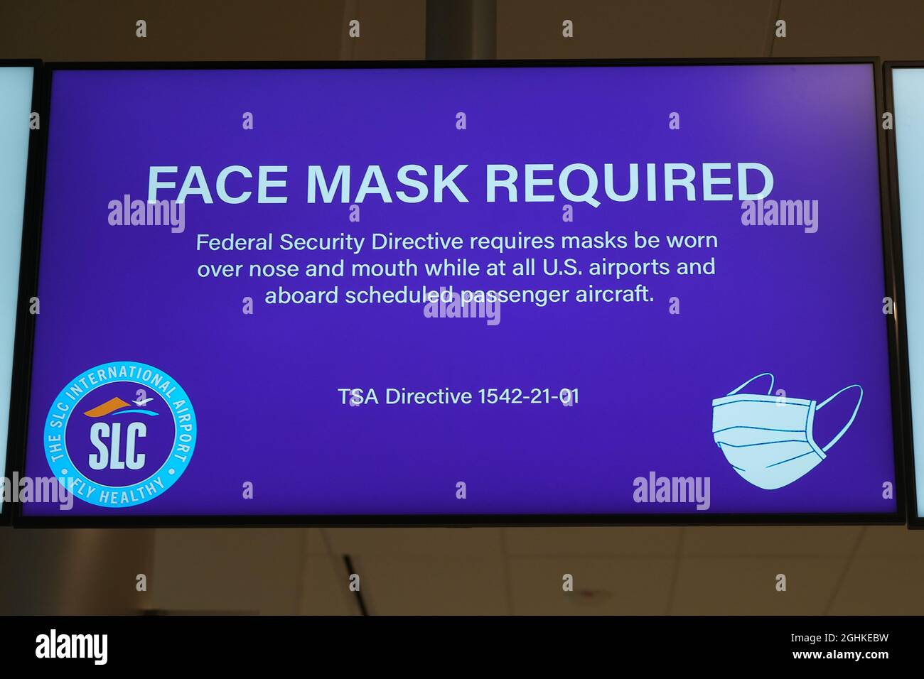 A face mask required sign at the TSA security checkpoint at the Salt Lake City International Airport amid the global coronavirus COVID-19 pandemic, Su Stock Photo