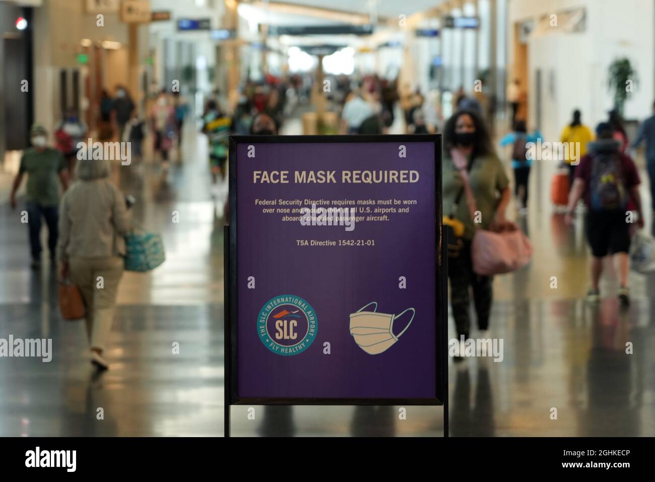 A face mask required sign at the Salt Lake City International Airport amid the global coronavirus COVID-19 pandemic, Sunday, Sept. 5, 2021, in Salt La Stock Photo