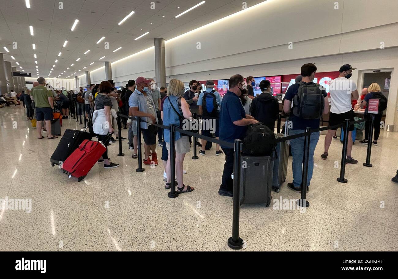 Salt Lake City, United States. 04th Sep, 2021. People wait in line at the  Avis counter at the Salt Lake City International Airport rental car center  amid the global coronavirus COVID-19 pandemic,