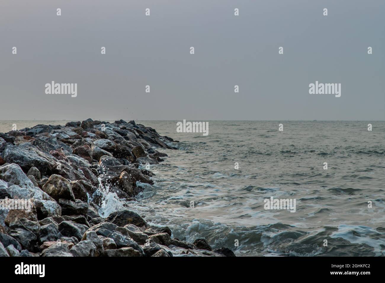 Rocks and sea : View of sea waves hitting rocks on the Calm beach in ...