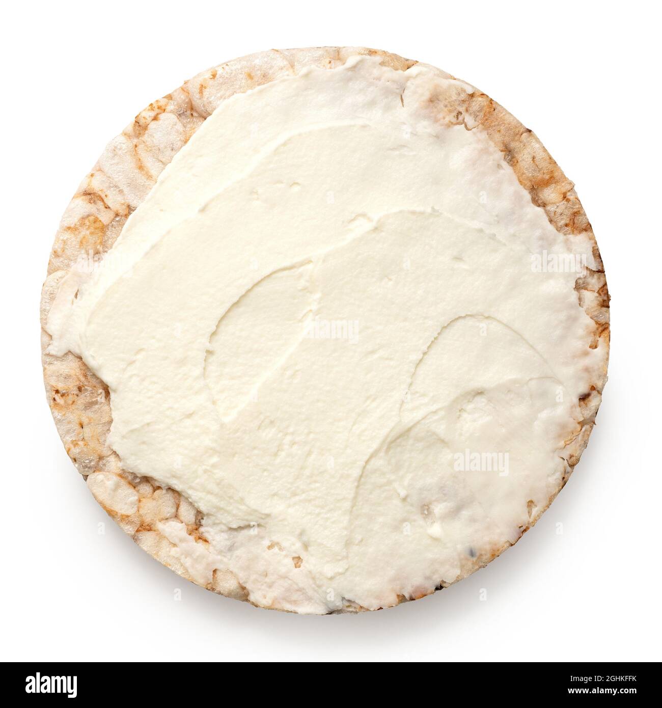 Puffed brown rice cake with cream cheese spread isolated on white. Top view. Stock Photo