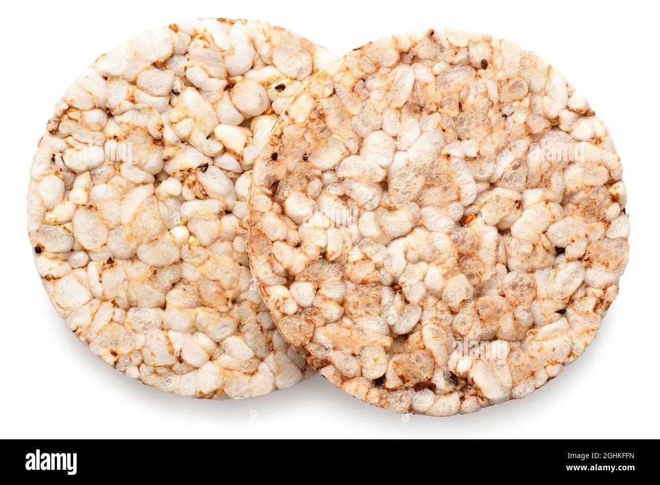 Two plain puffed brown rice cakes isolated on white. Top view. Stock Photo