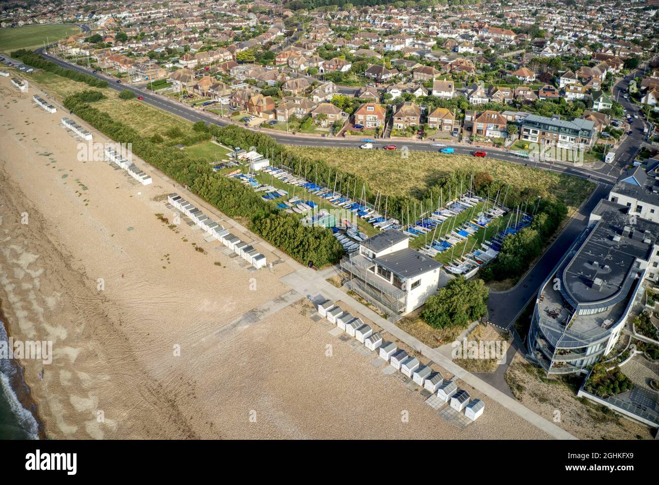Aerial of Goring by Sea beach with Sailing Dinghies in view at the Yacht Club behind the beach Aerial of Goring by Sea beach with Sailing Dinghies in view at the Yacht Club behind the beach