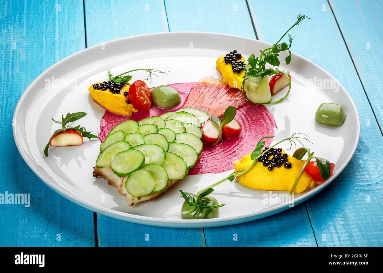 Fish dish - fried fish fillet and vegetables Stock Photo - Alamy