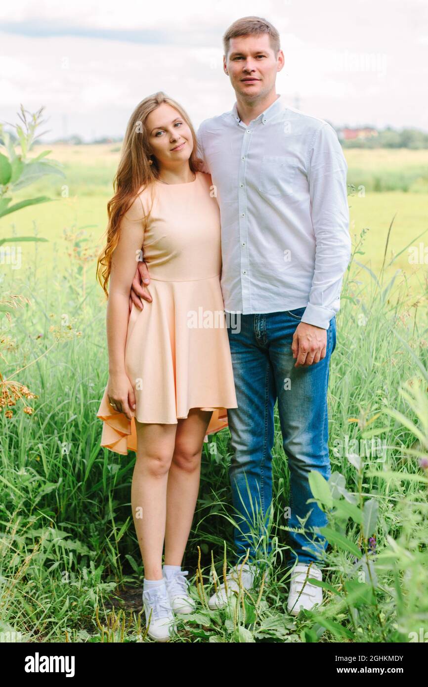 Beautiful couple hugging in the park outdoors Stock Photo - Alamy