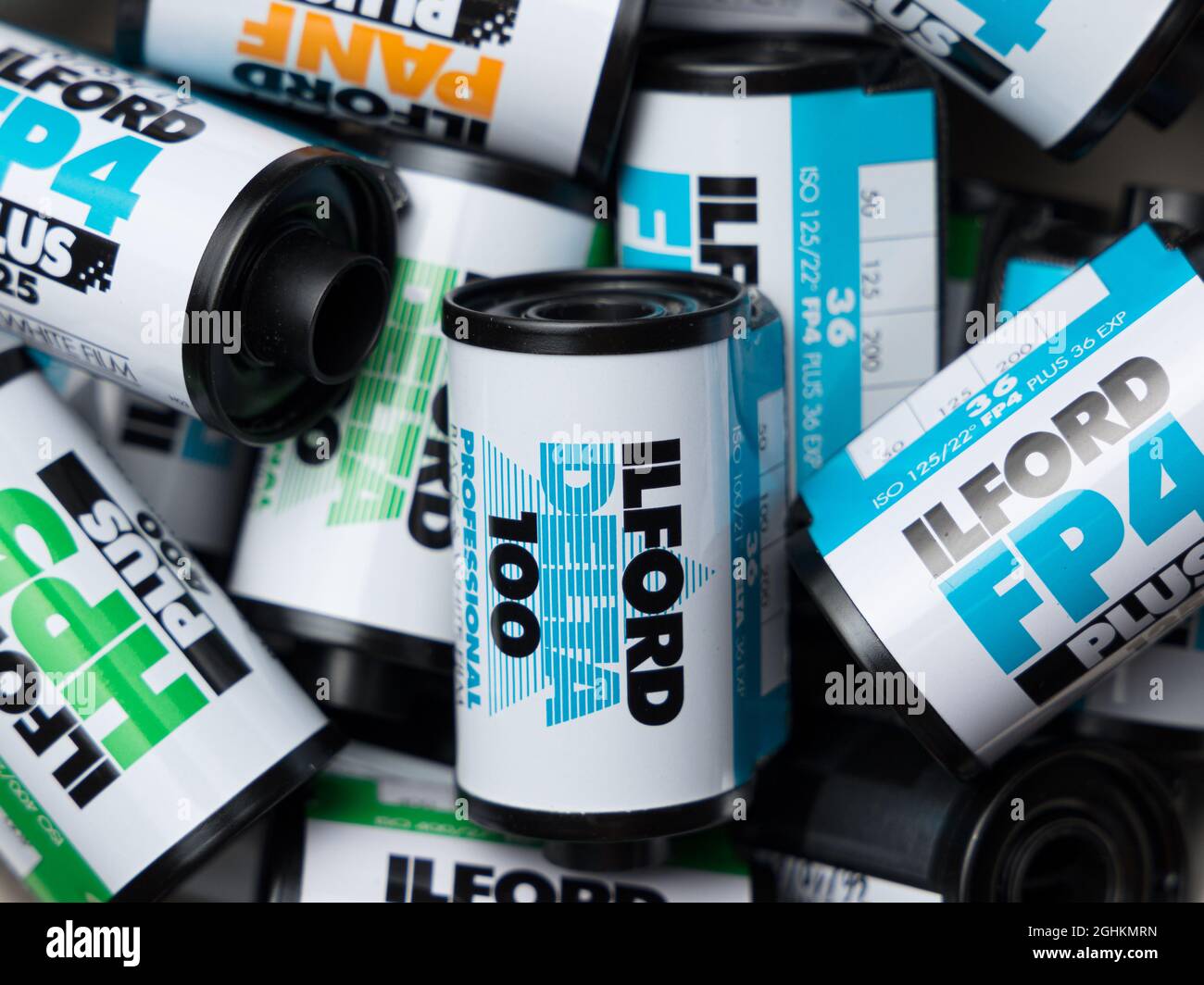 VALENCIA, SPAIN - SEPTEMBER 06, 2021: Pile of black and white 35mm film rolls, made by Ilford . Film photography comeback concept Stock Photo