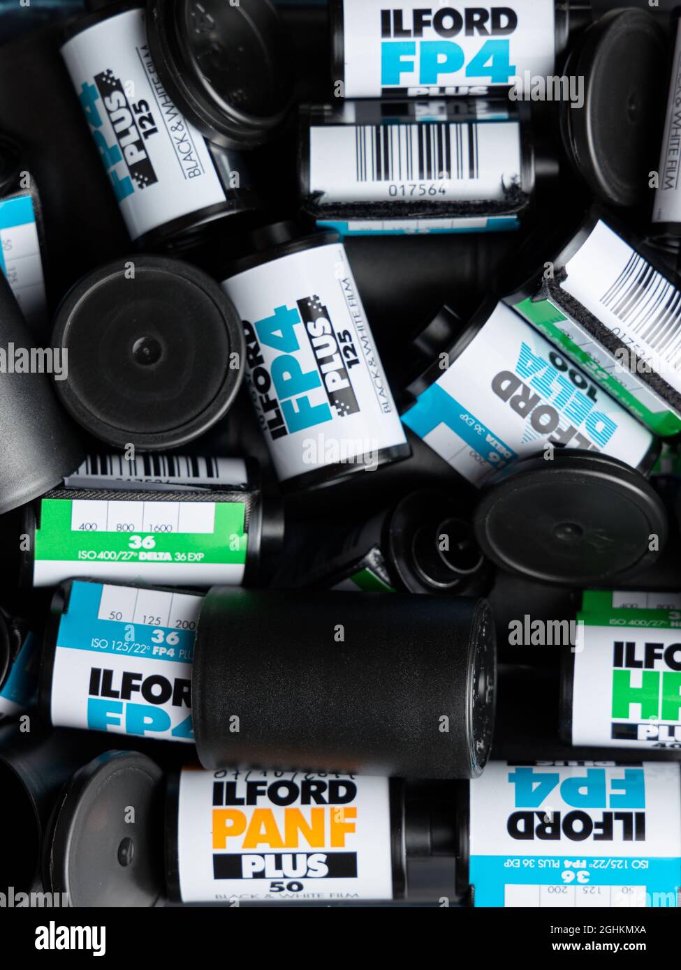 VALENCIA, SPAIN - SEPTEMBER 06, 2021: Pile of black and white 35mm film rolls, made by Ilford . Film photography comeback concept Stock Photo
