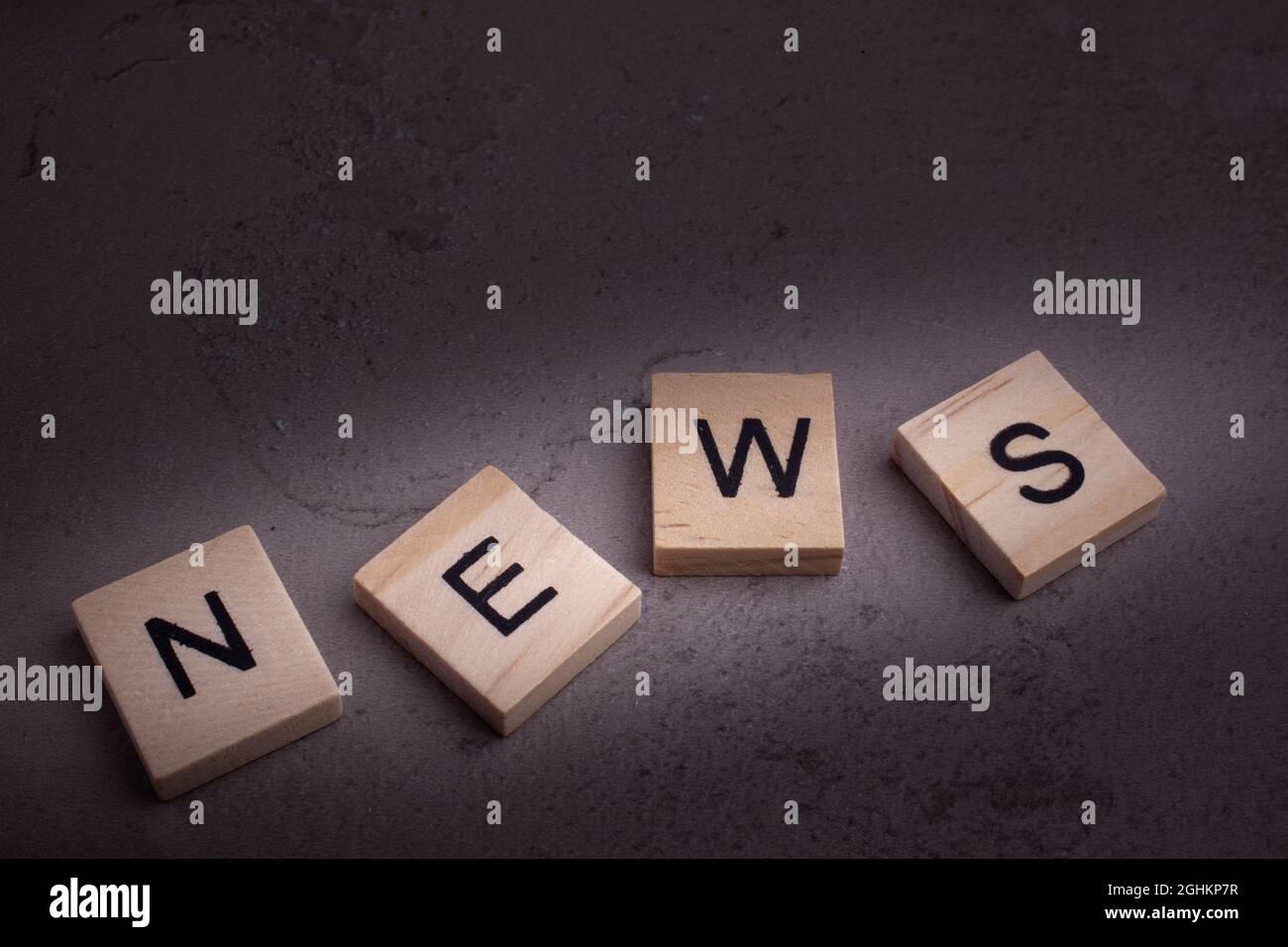 Top view of wooden blocks with letters -text  news Stock Photo