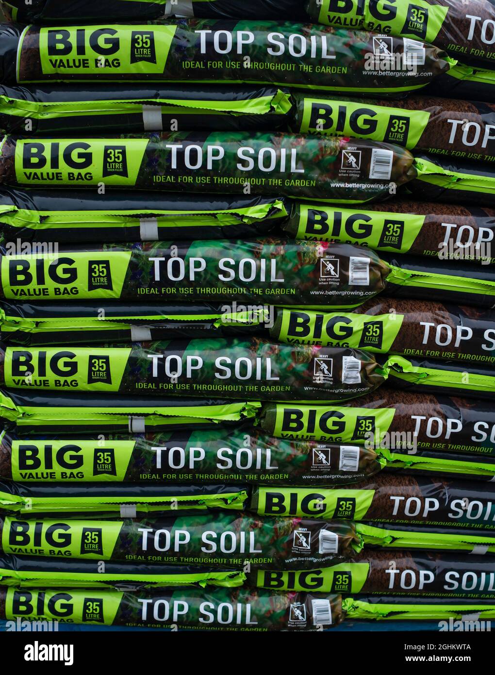 A stack of bags of Top Soil in a farm shop Stock Photo