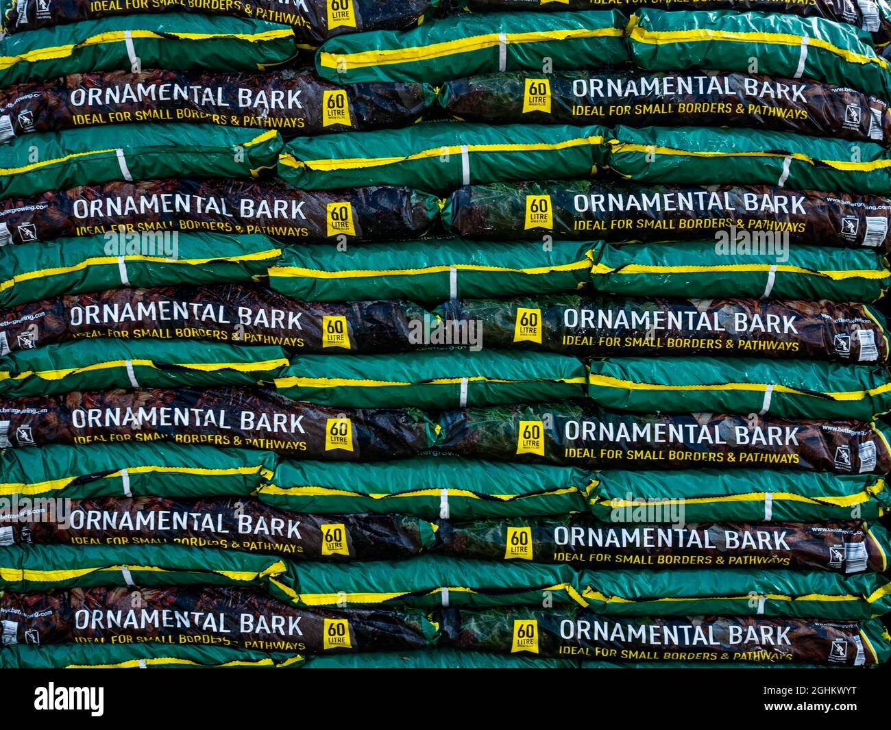 A stack of  bags of Ornamental Bark ideal for small borders and pathways in a farm shop Stock Photo