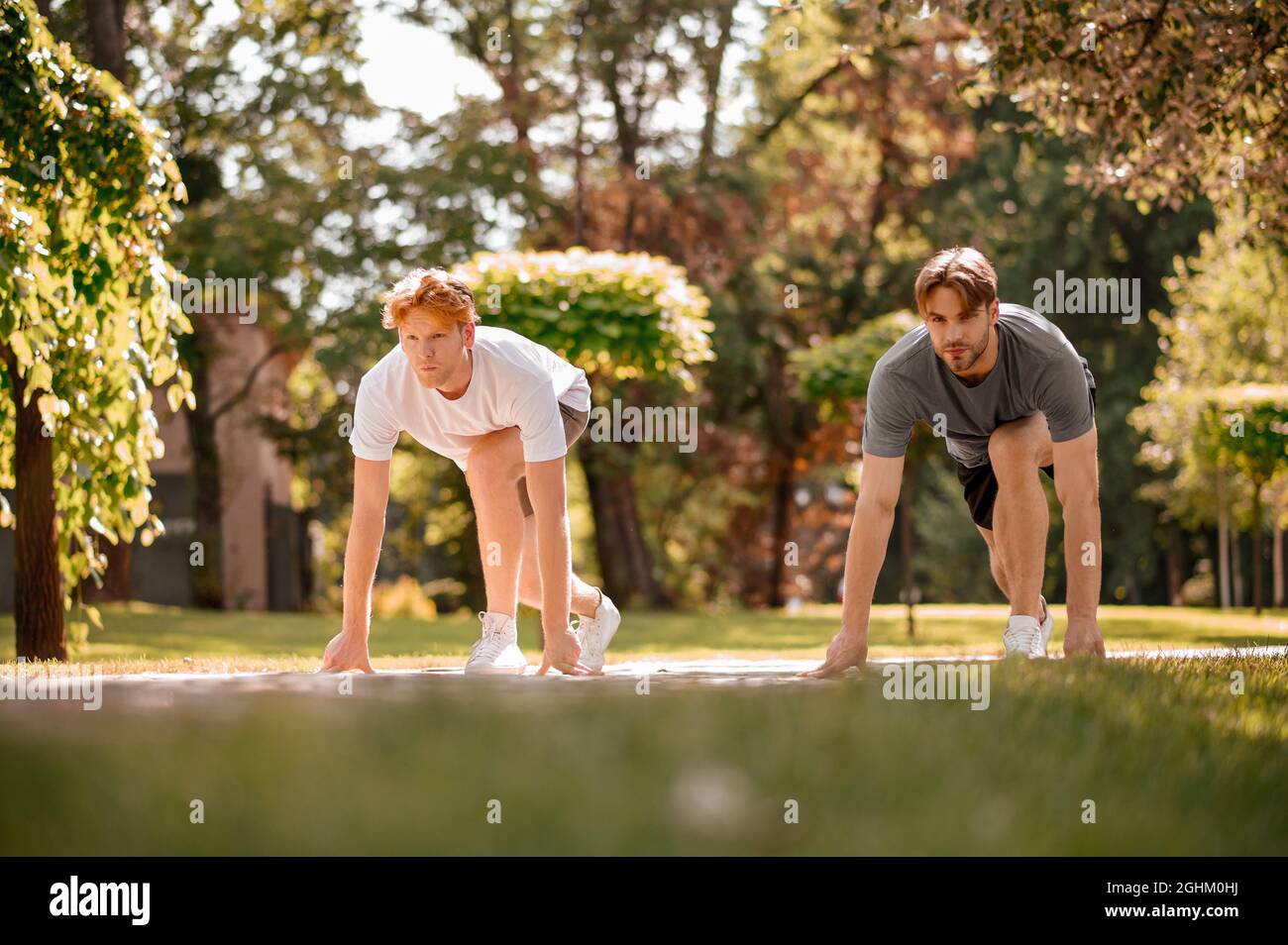 Guys getting ready for running competition. Stock Photo