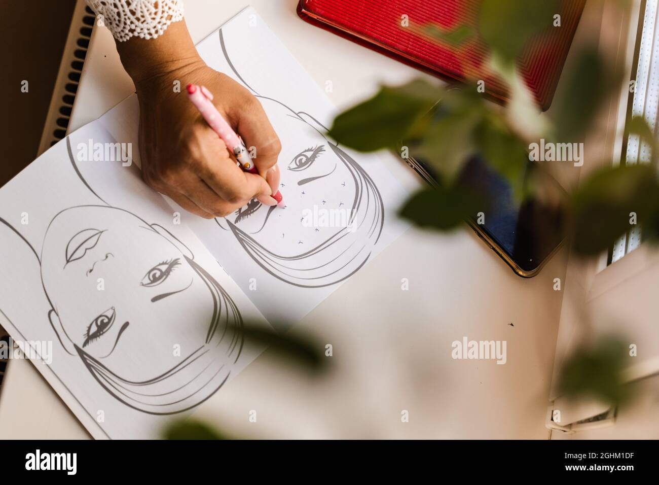 Beautician drawing zone of mimic activity in the patient chart in the ...