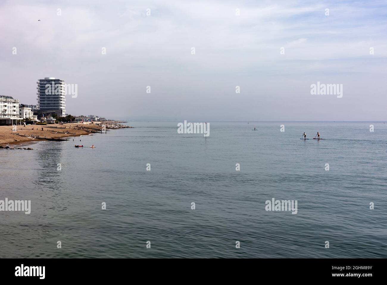 people paddle boarding in the sea in Worthing, West Sussex, UK, in September 2021 Stock Photo