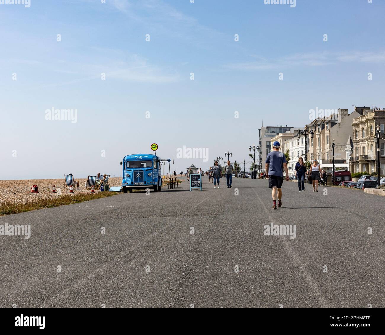 people walking along the promenade in Worthing, West Sussex, in September 2021 Stock Photo