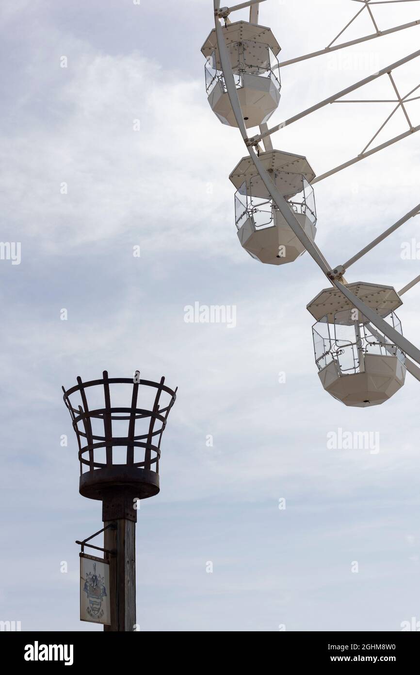Worthing Observation Wheel and unlit beacon post during September 2021 Stock Photo