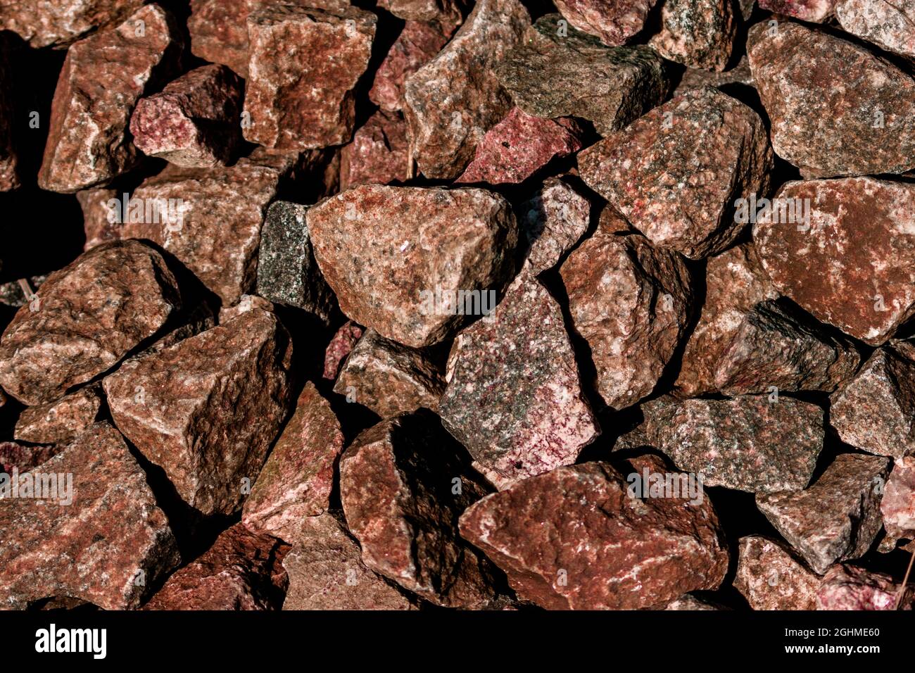 There are many brown and orange colored granite stones. Stone texture. Stock Photo