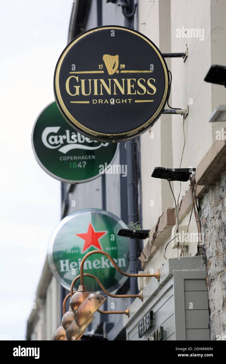 Beer signs above a pub in Sligo with a Guinness sign the most prominent among them. Stock Photo