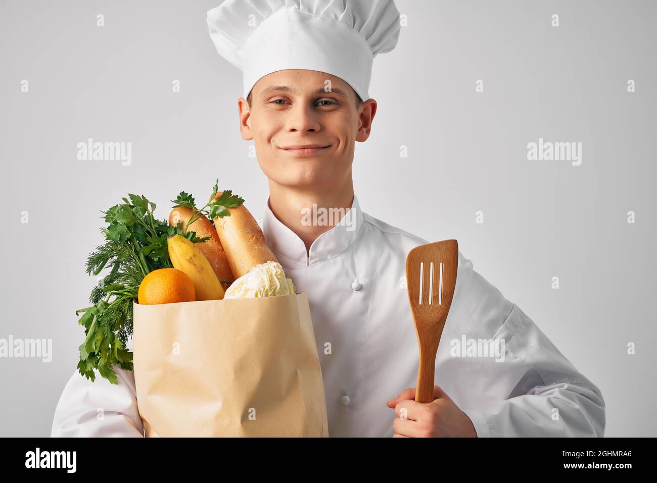man in chef uniform food service package food preparation healthy Stock Photo Alamy