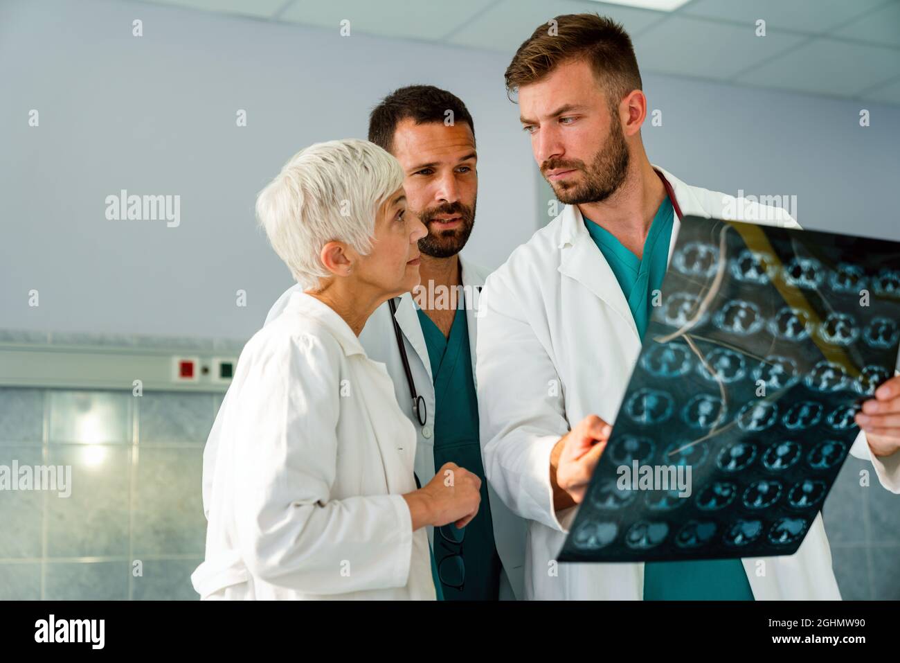 Radiologist doctor consulting with colleagues an xray scan in hospital