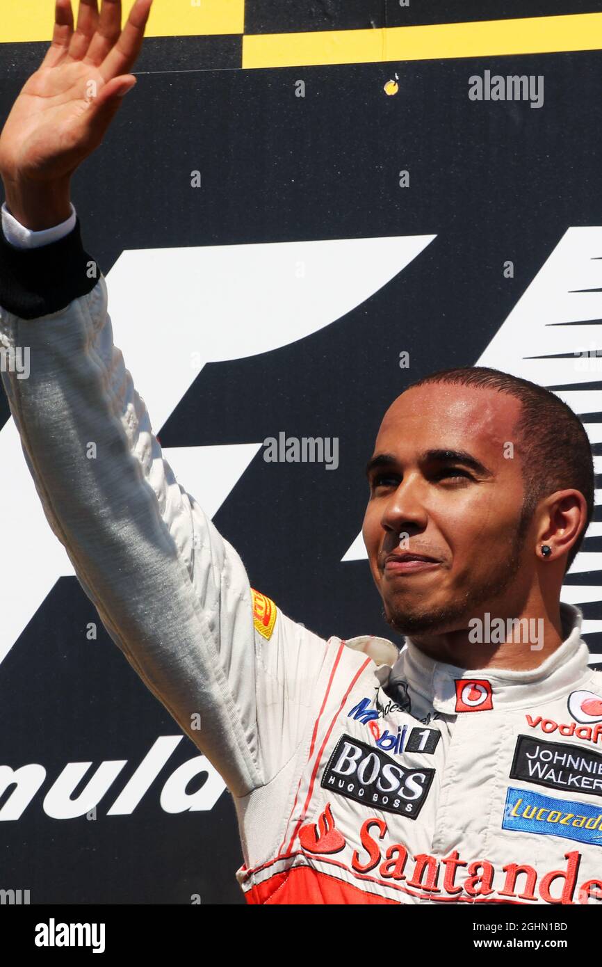 Race winner Lewis Hamilton (GBR) McLaren celebrates on the podium. 10.