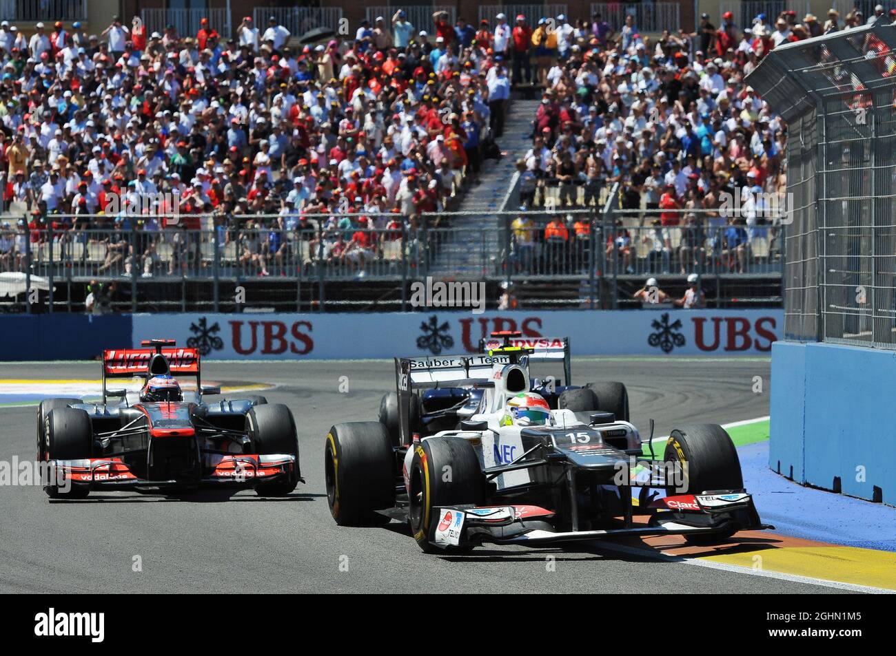 Sergio Perez (MEX) Sauber C31 leads Jenson Button (GBR) McLaren MP4/27.  24.06.2012. Formula 1 World Championship, Rd 8, European Grand Prix,  Valencia, Spain, Race Day Stock Photo - Alamy