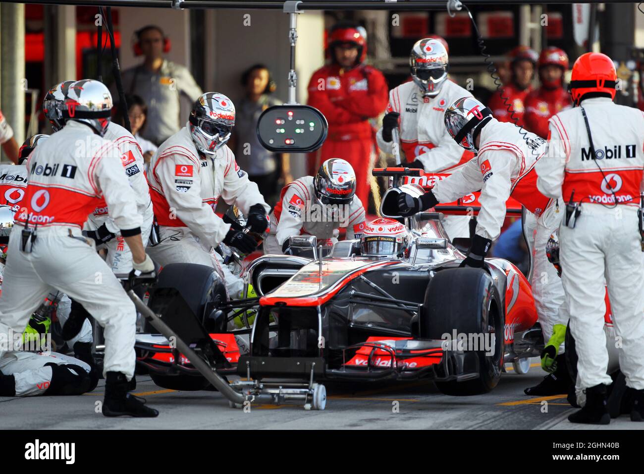 Jenson Button (GBR) McLaren MP4/27 makes a pit stop. 07.10