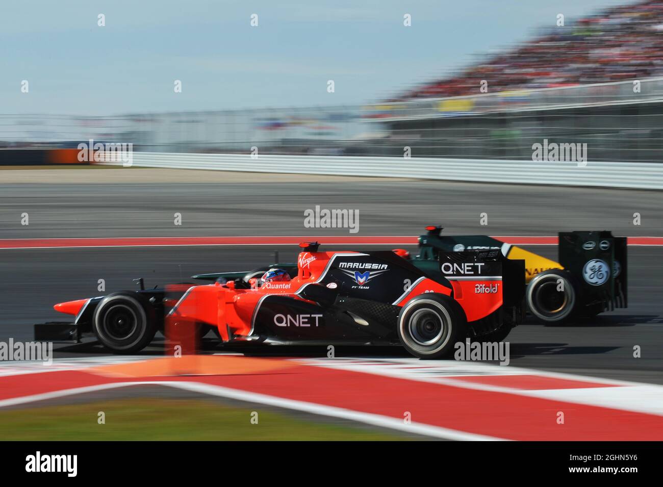 Timo Glock (GER) Marussia F1 Team MR01 and Heikki Kovalainen (FIN