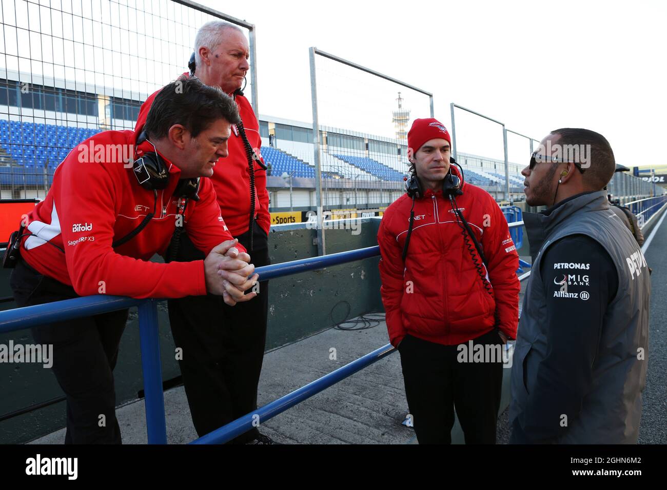 Lewis Hamilton (GBR) Mercedes AMG F1 with (L to R): Graeme Lowdon (GBR)  Marussia F1 Team Chief Executive Officer, John Booth (GBR) Marussia F1 Team  Team Principal and Marc Hynes (GBR) Marussia