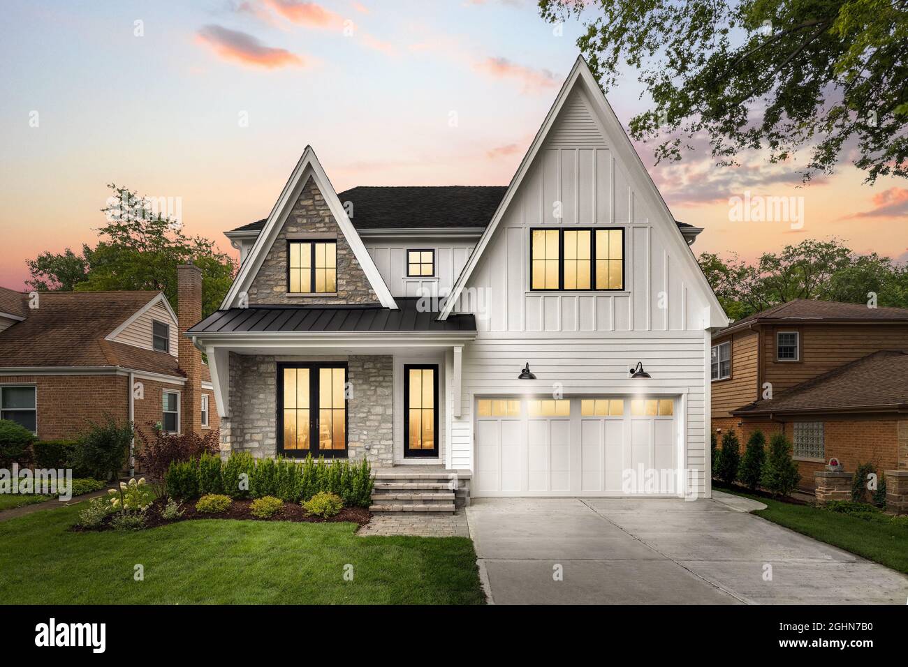 A new, white modern farmhouse with rock siding at sunset Stock Photo - Alamy, image size:1300x956
