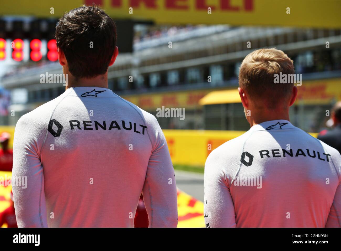 (L to R): Jolyon Palmer (GBR) Renault Sport F1 Team and team mate Kevin Magnussen (DEN) Renault Sport F1 Team as the grid observes the national anthem.  15.05.2016. Formula 1 World Championship, Rd 5, Spanish Grand Prix, Barcelona, Spain, Race Day.  Photo credit should read: XPB/Press Association Images. Stock Photo
