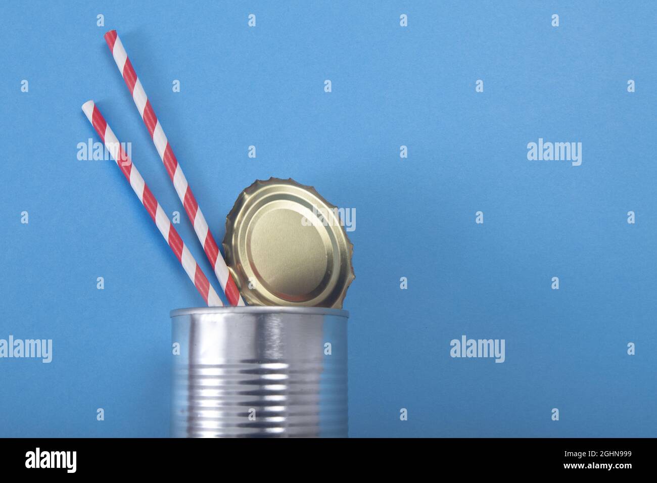 Closeup of an open metal can with two strip drinking straws Stock Photo ...