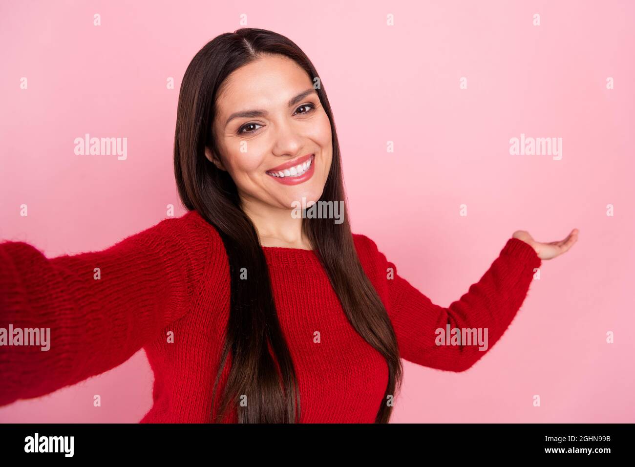 Photo of excited brunette lady do selfie hold empty space wear red ...