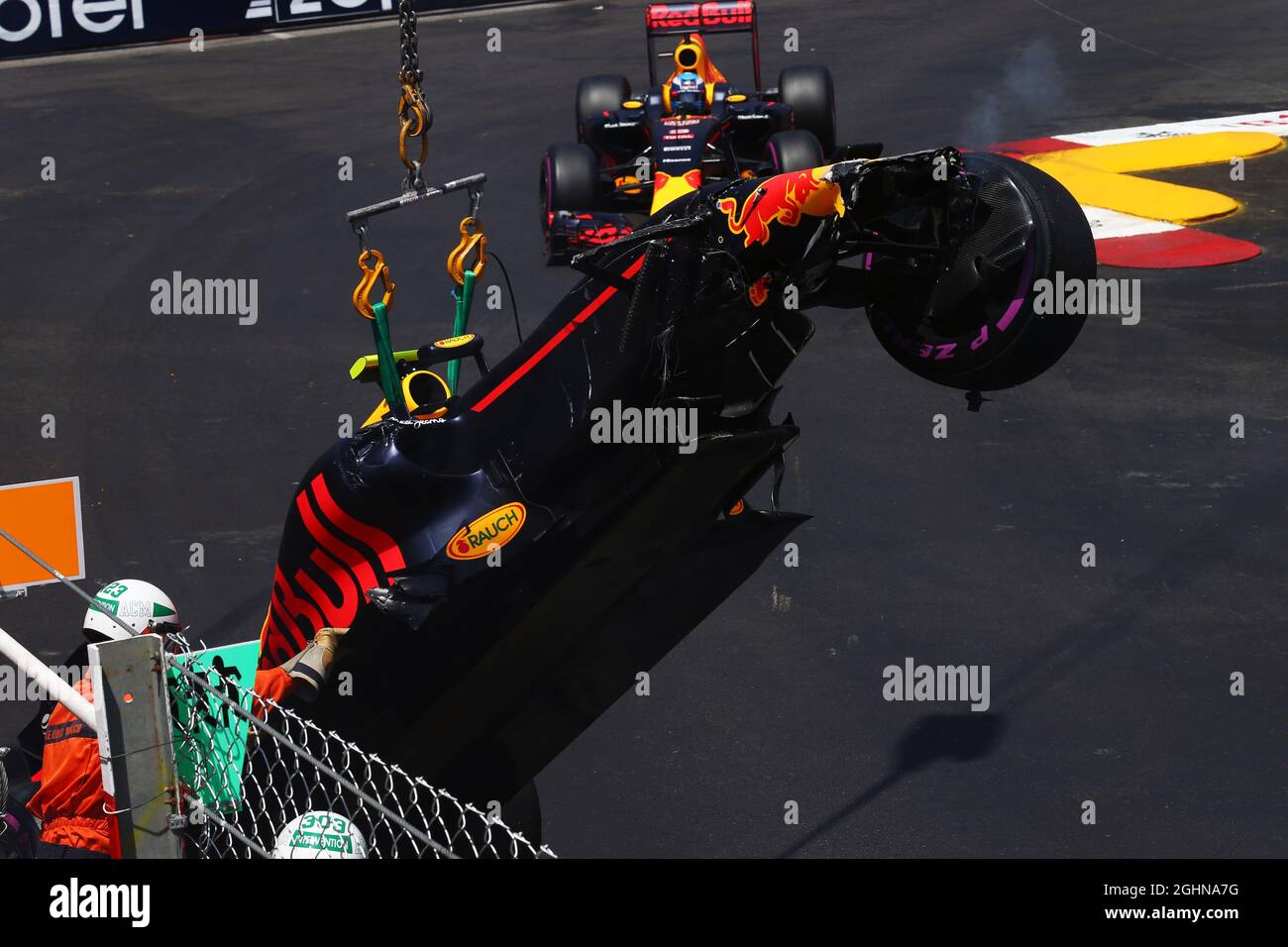 Daniel Ricciardo (AUS) Red Bull Racing RB12 passes the RB12 of his team mate Max Verstappen (NLD), who crashed out of qualifying.  28.05.2016. Formula 1 World Championship, Rd 6, Monaco Grand Prix, Monte Carlo, Monaco, Qualifying Day.  Photo credit should read: XPB/Press Association Images. Stock Photo
