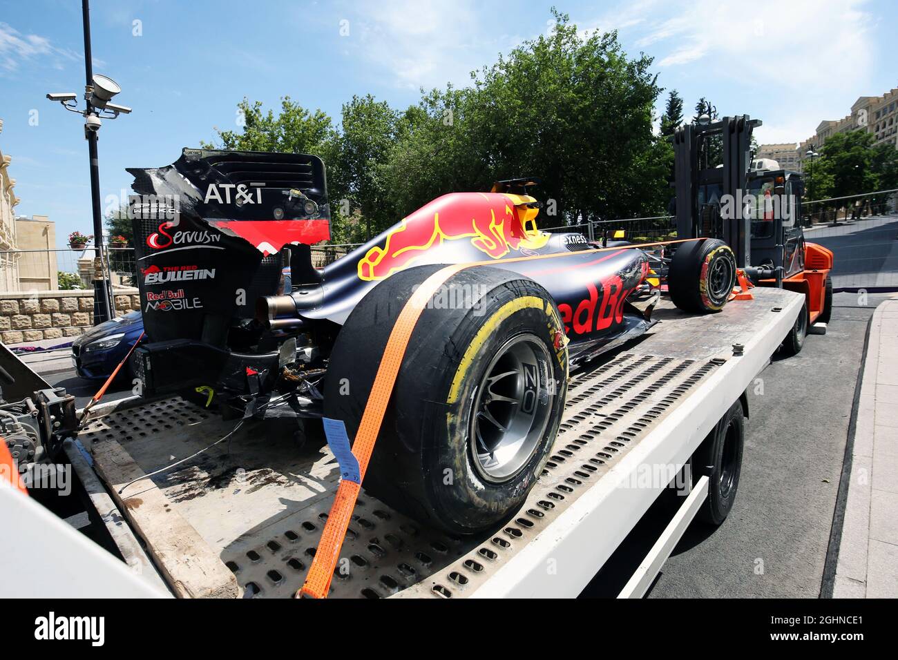 The damaged Red Bull Racing RB12 of Daniel Ricciardo (AUS) is recovered  back to the pits on the back of a truck. 17.06.2016. Formula 1 World  Championship, Rd 8, European Grand Prix,