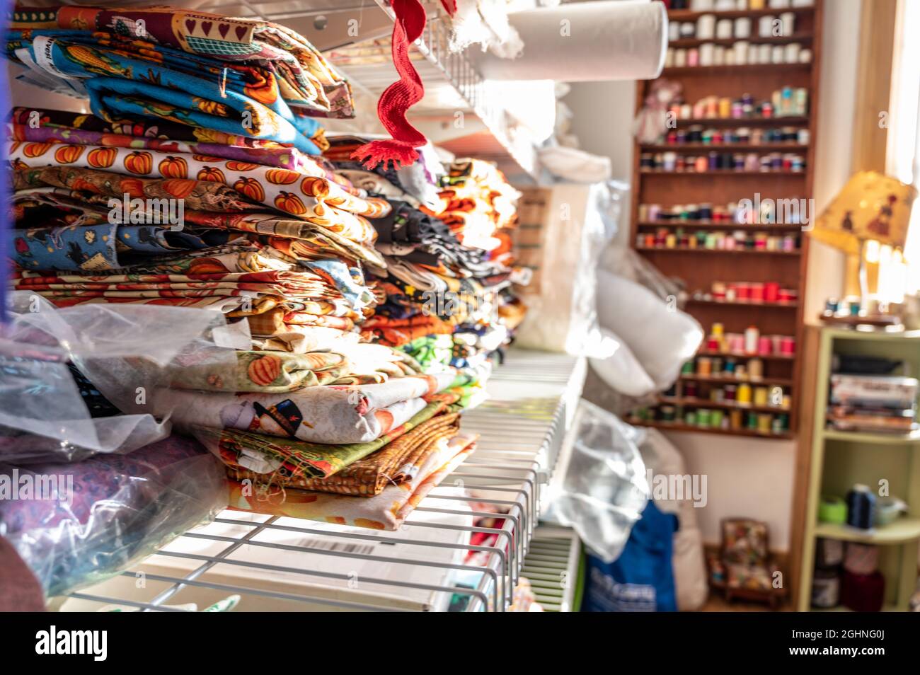 Assorted pile of fabric and bolts of cloth Stock Photo Alamy